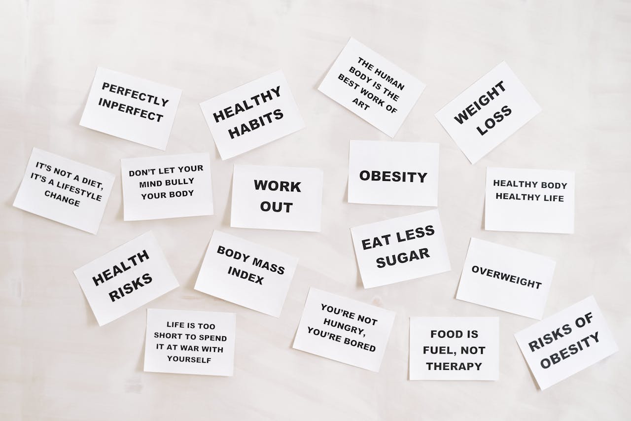 Collection of motivational health and fitness messages on white cards, promoting a healthy lifestyle.